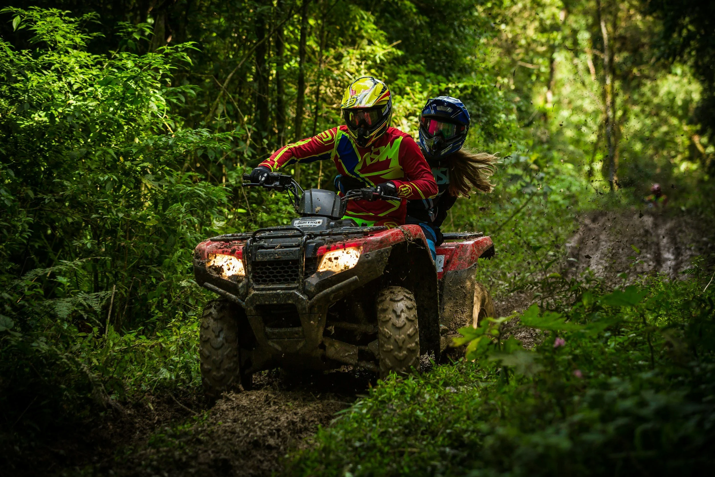 two people on an atv