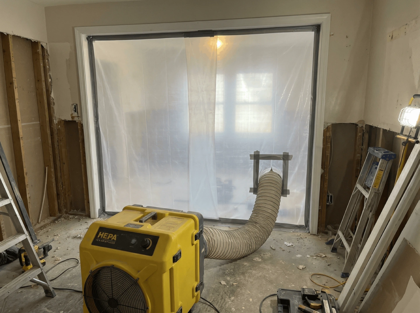 Professional HEPA air filtration and containment zone set up for safe lead paint removal in Fort Collins.