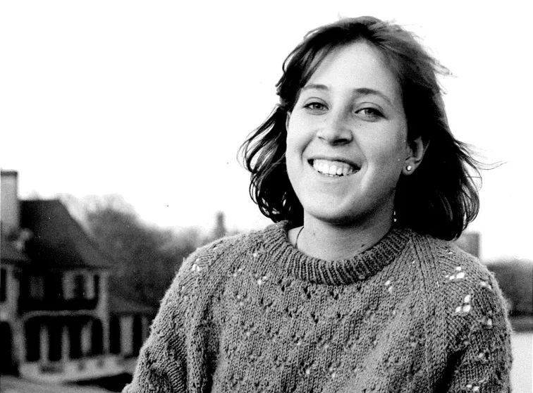 An image of a woman smiling at the camera