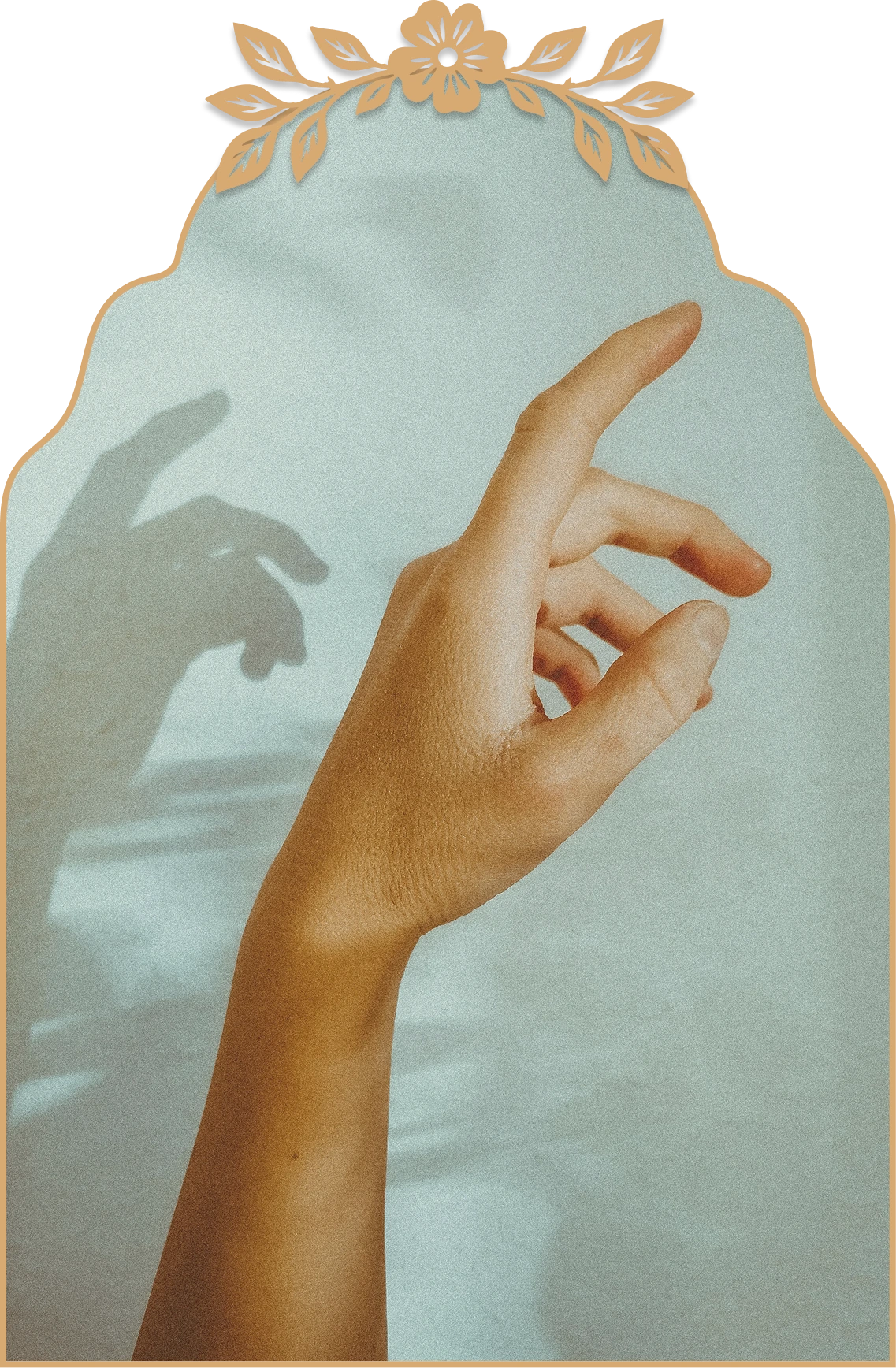 Hand with fingers gently curved casting a soft shadow on a light blue-gray background.