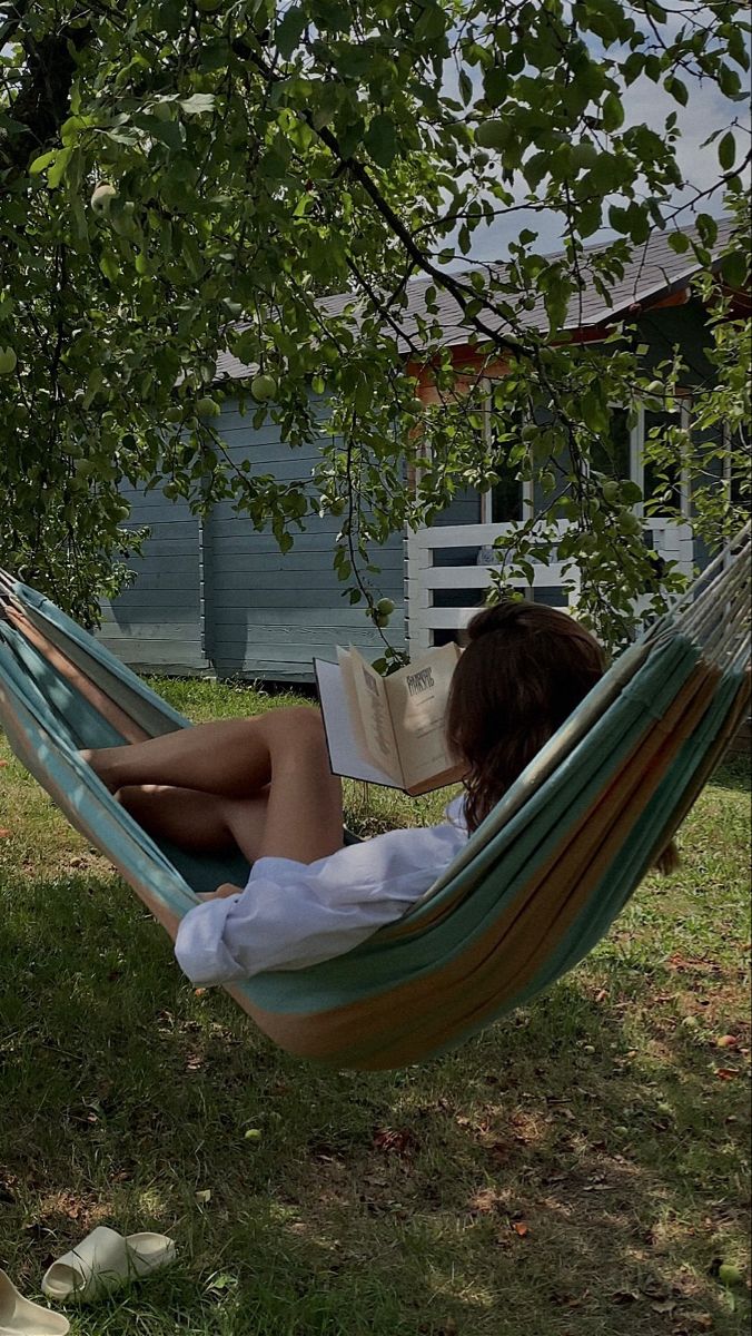 woman in hammock reading a book