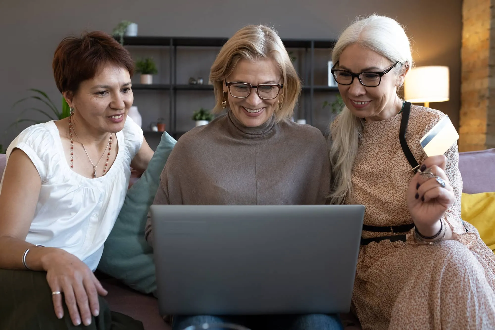 happy women on a laptop during a virtual appointment.