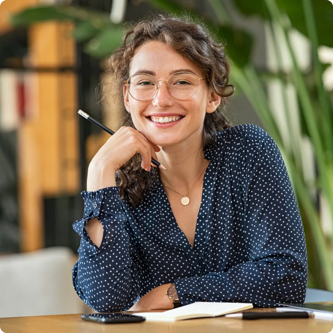 Woman smiling at her desk
