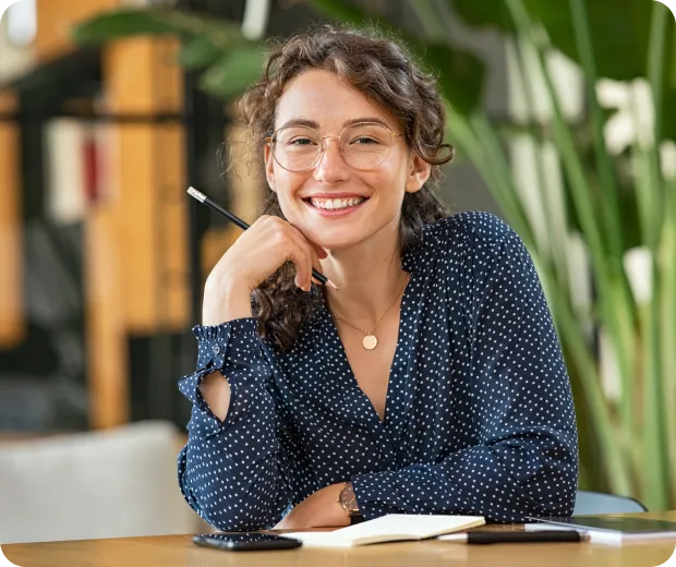 Woman smiling at her desk