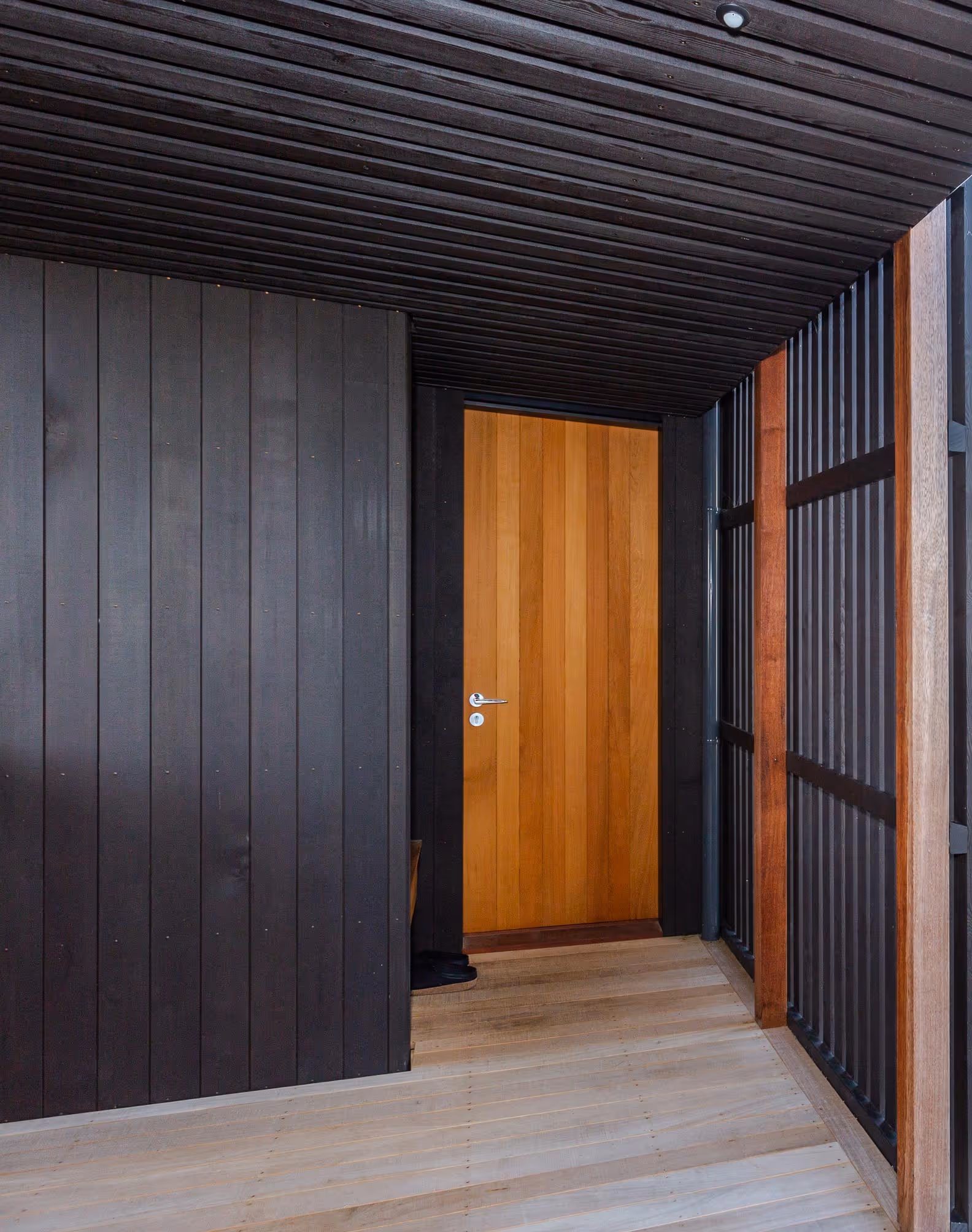 Dark cedar claddingleading to the front door at Glenmorven Studio 