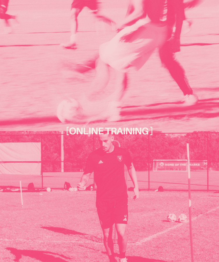 Young man wearing a black Nike sports jacket standing beside a chain-link fence, looking to the side.