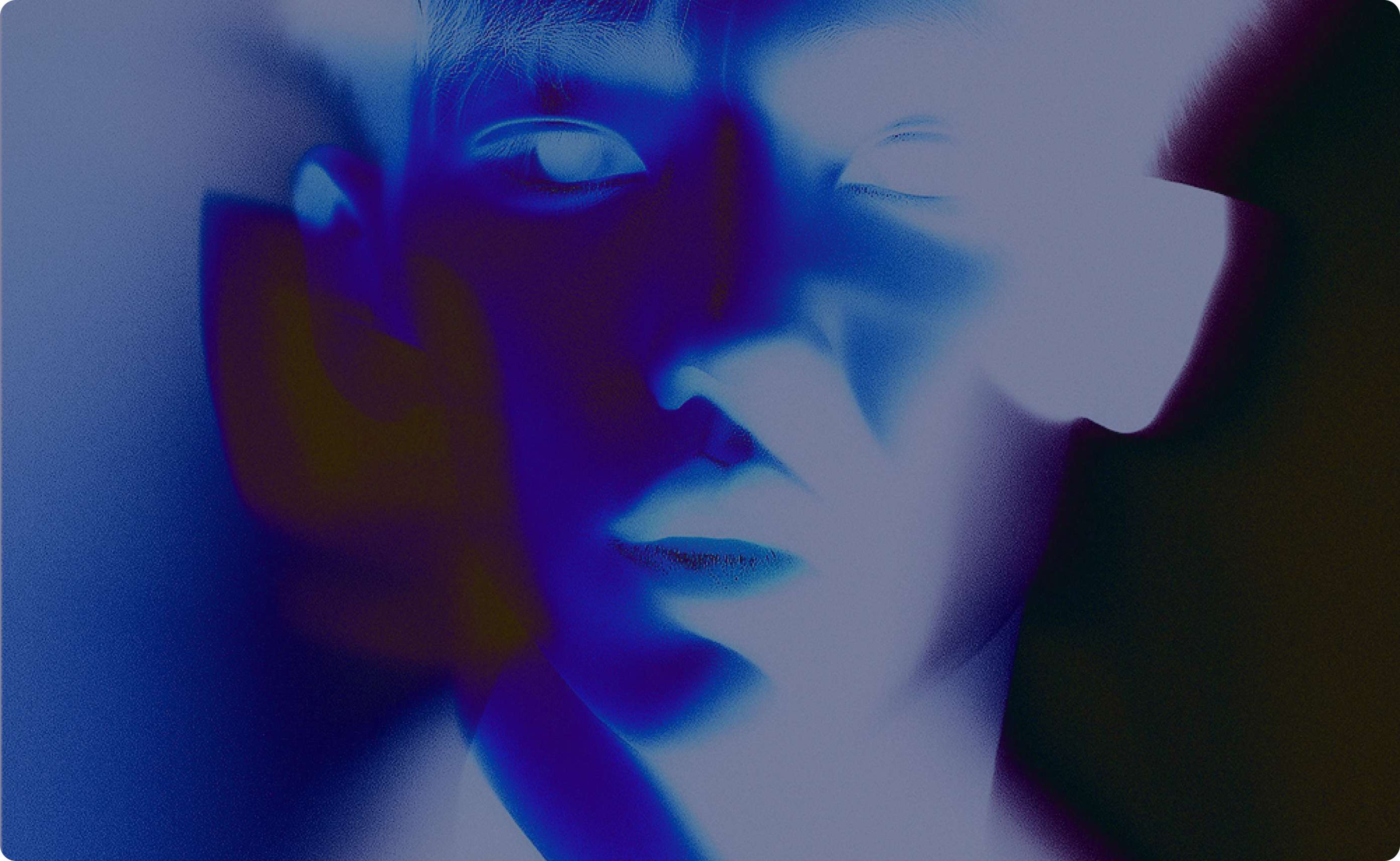 Abstract close-up of a face with eyes closed in blue and purple hues and soft shadows.