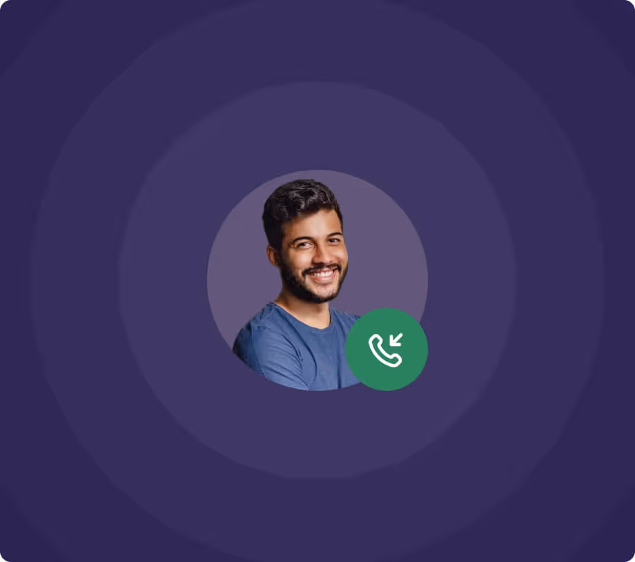 Smiling man with dark hair and beard wearing a blue shirt in a circular frame with a green incoming call icon.