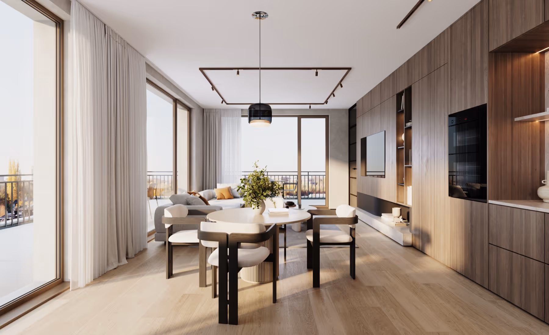 Moderne eetkamer van nieuwbouwproject Planeta in Wilrijk met vier stoelen rond een ronde tafel met vaas groen, aansluitend op een gezellige zithoek en grote ramen met lichte gordijnen.