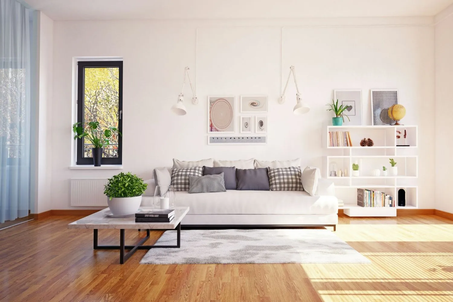 Bright living room with white sofa, black-and-white patterned cushions, marble coffee table with green plant, and white shelving unit with books and decor.