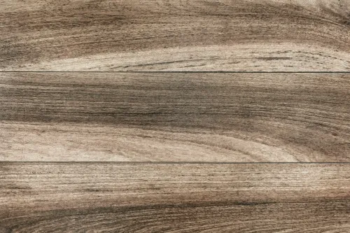 Close-up of wood grain texture on horizontal wooden planks in varying brown shades.
