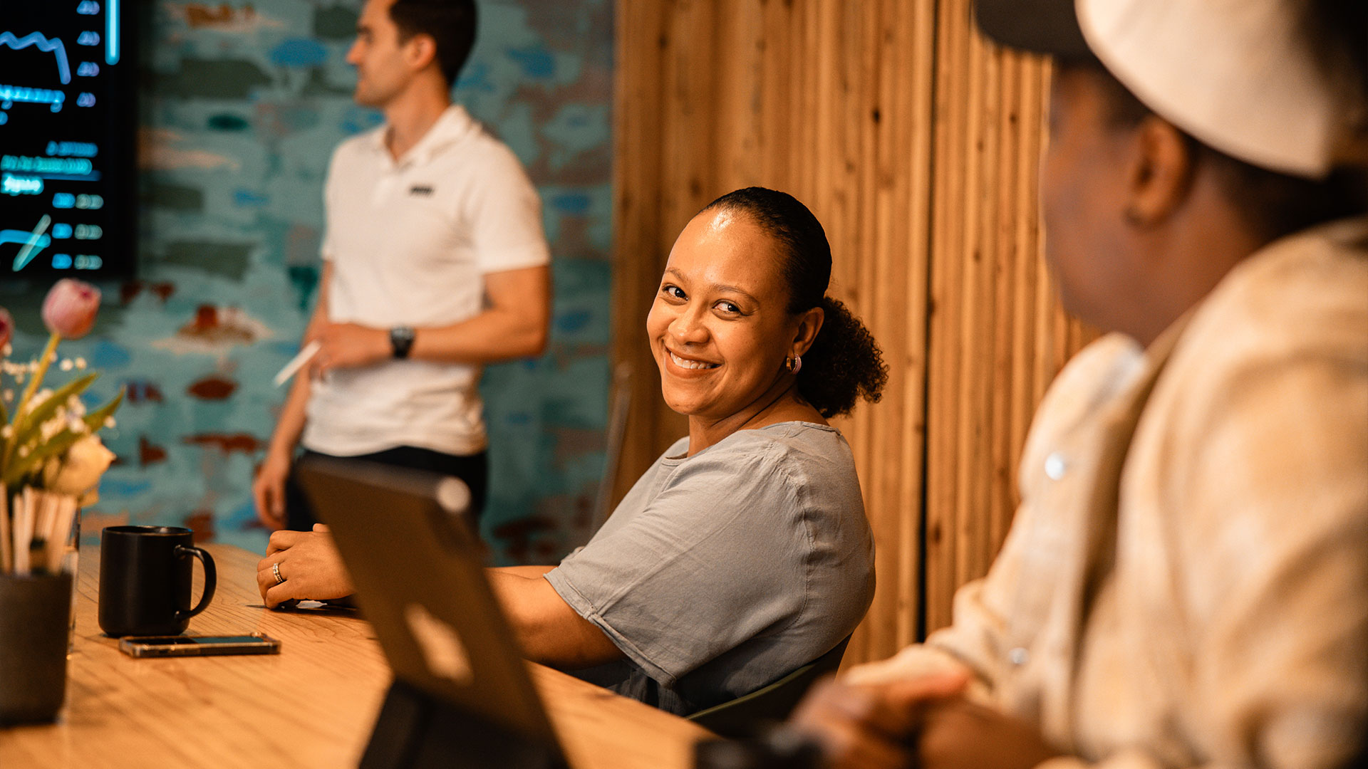 A diverse team of co-workers have a great meeting in the echo boardroom.