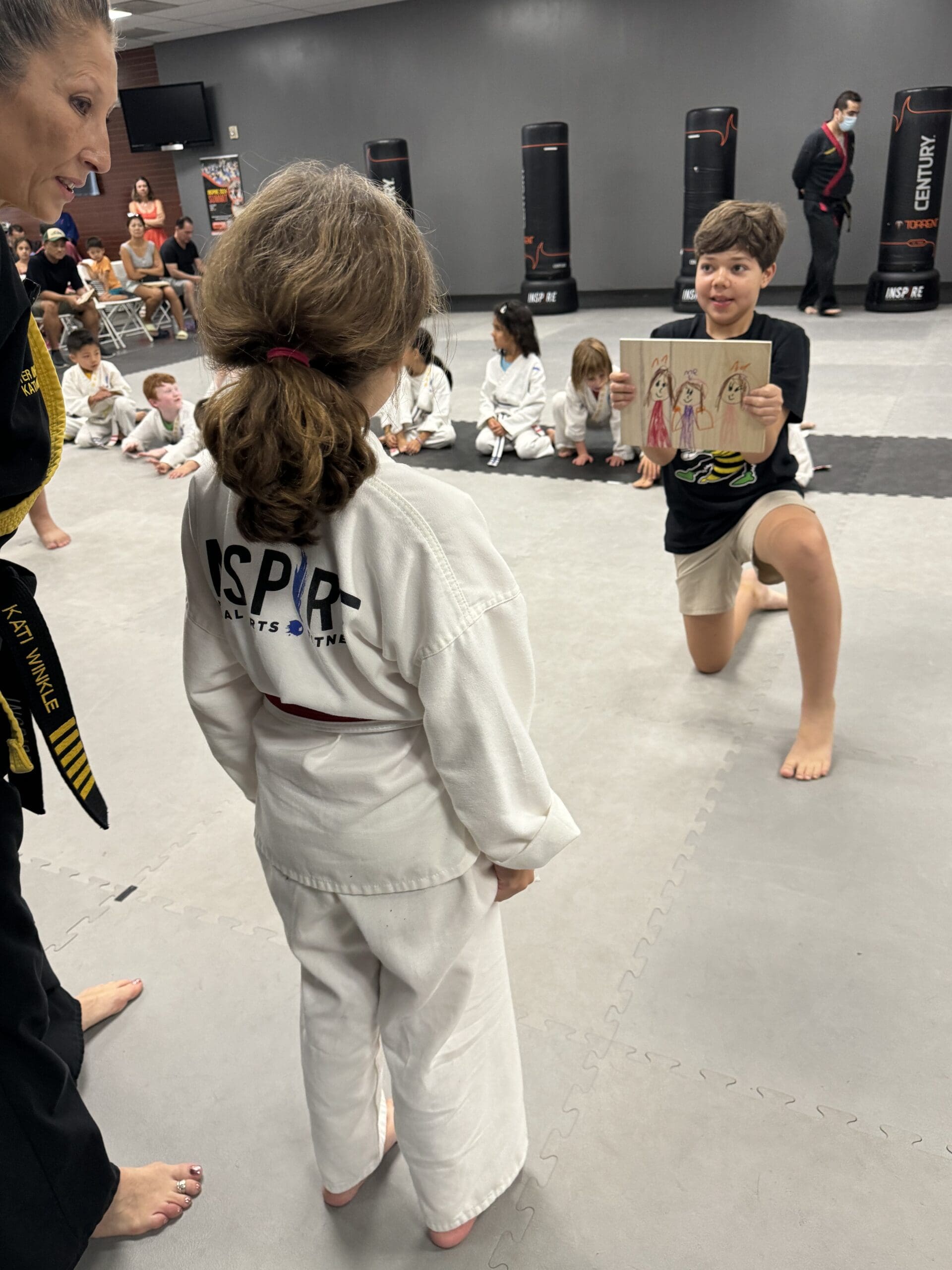When a child attends taekwondo at a young age, they not only practice martial arts and learn self-defense skills in a taekwondo uniform with shin guards, but also develop self-control, social skills, and stress relief as students learn new techniques and grow through tae kwon training.