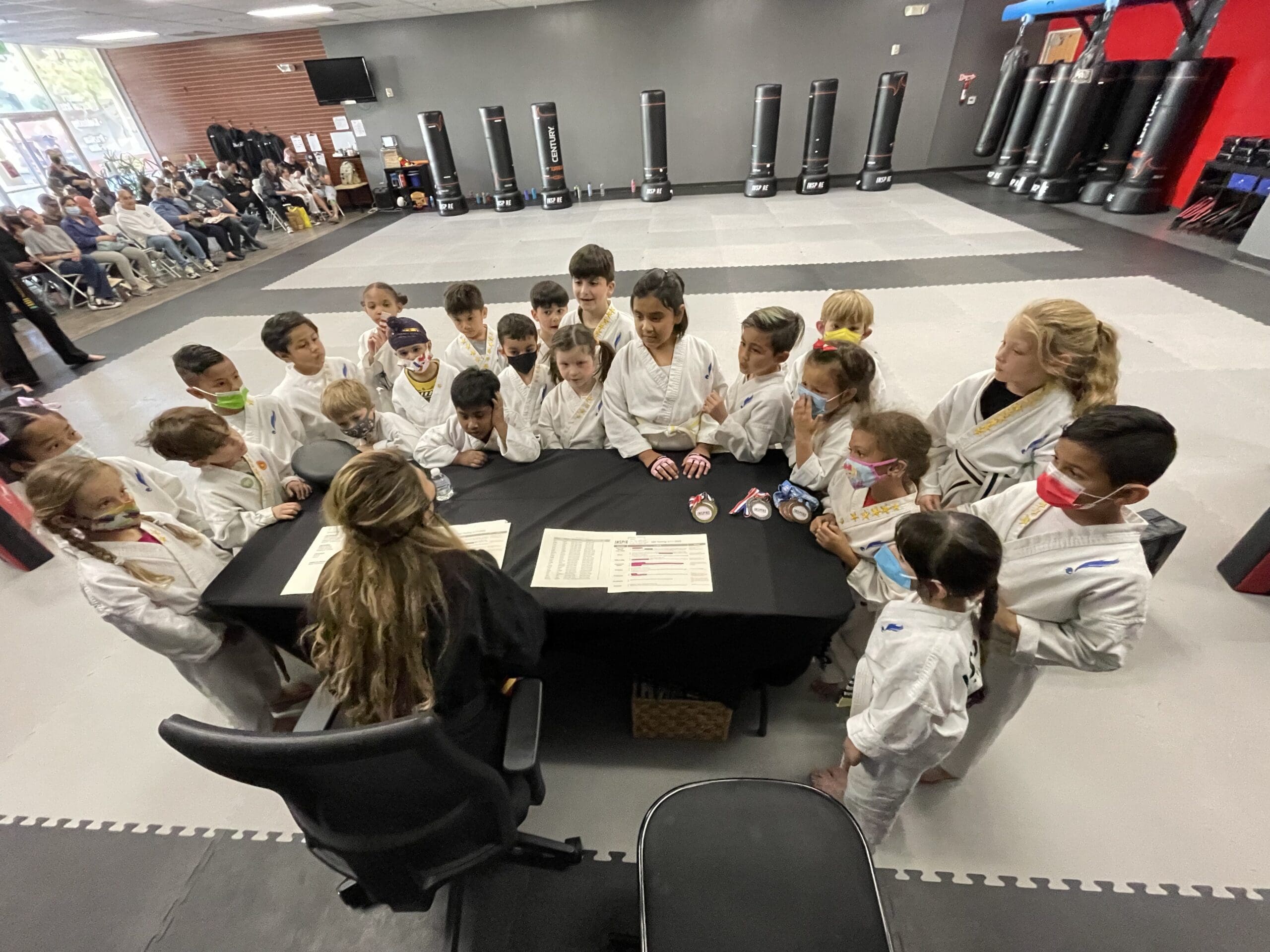 Preschool taekwondo classes introduce young children to the fundamentals of self-defense, physical fitness, and important values like respect, self-control, and confidence, all while having fun in a structured and supportive environment.