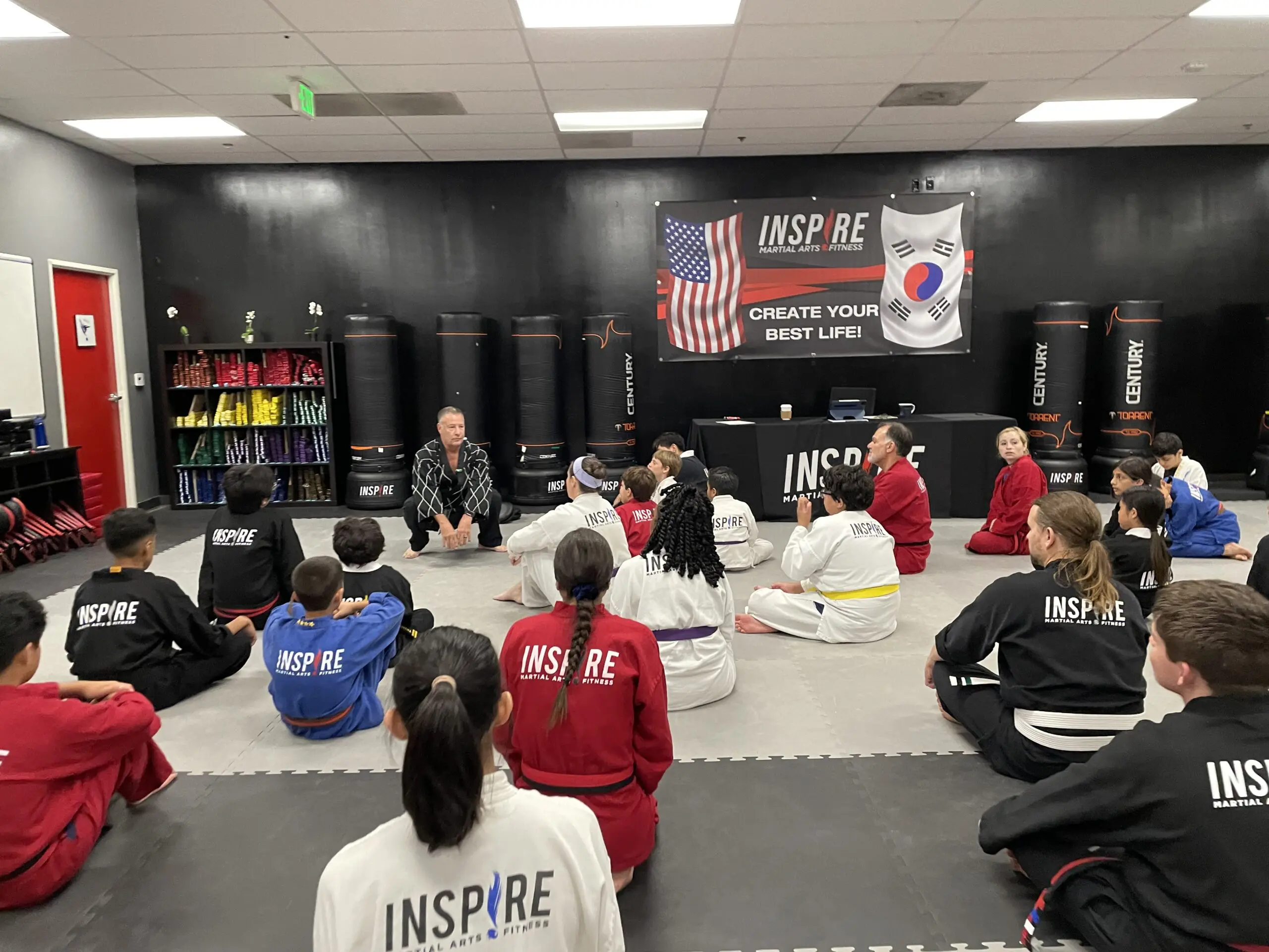 Teens learning martial arts like Taekwondo experience a positive impact on their mental well-being and academic performance as they train with experienced instructors, wear protective gear like shin guards, board breaking, learn new techniques, and self-control, self-discipline, building confidence, and self-esteem alongside fellow students learn—empowering them to resist peer pressure and pursue their goals.