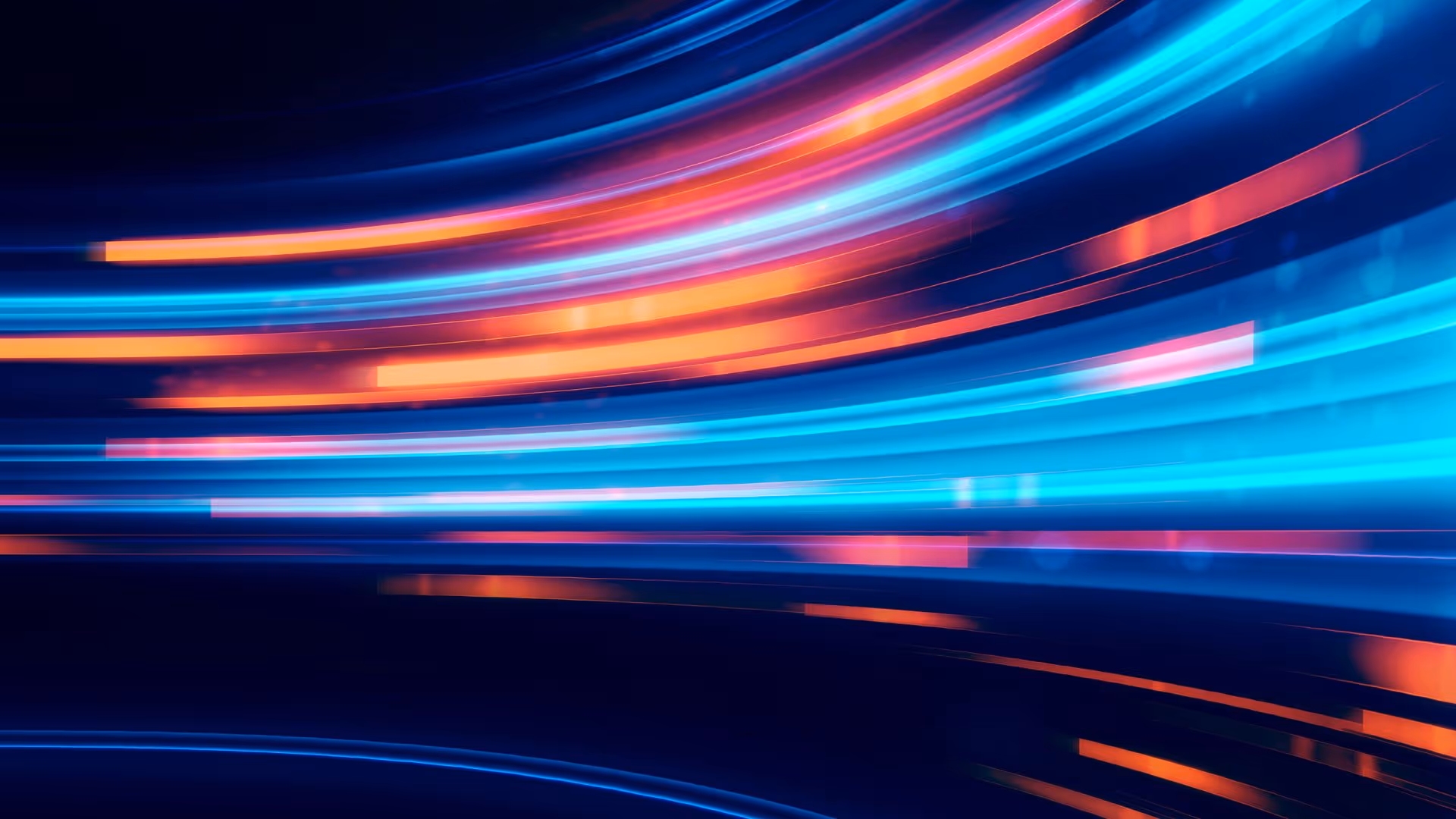 Movement of blue and orange bright lines on a dark background, technological abstract pattern.