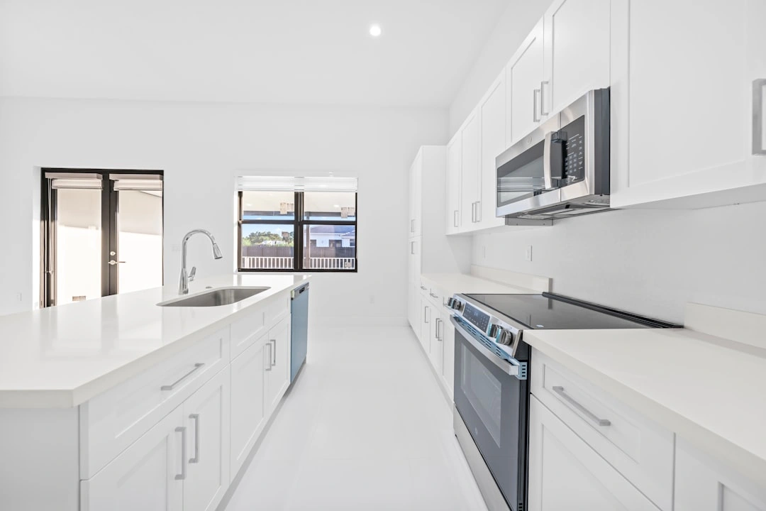 Gourmet kitchen with premium finishes and stainless steel appliances - 3 bedroom apartment for rent