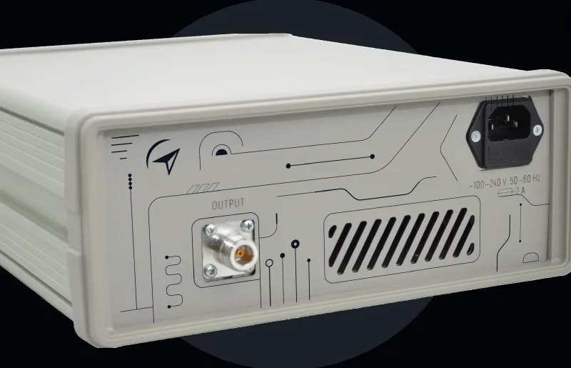 Rear view of a Pulse Generator device with output connector, ventilation grill, and power input socket.