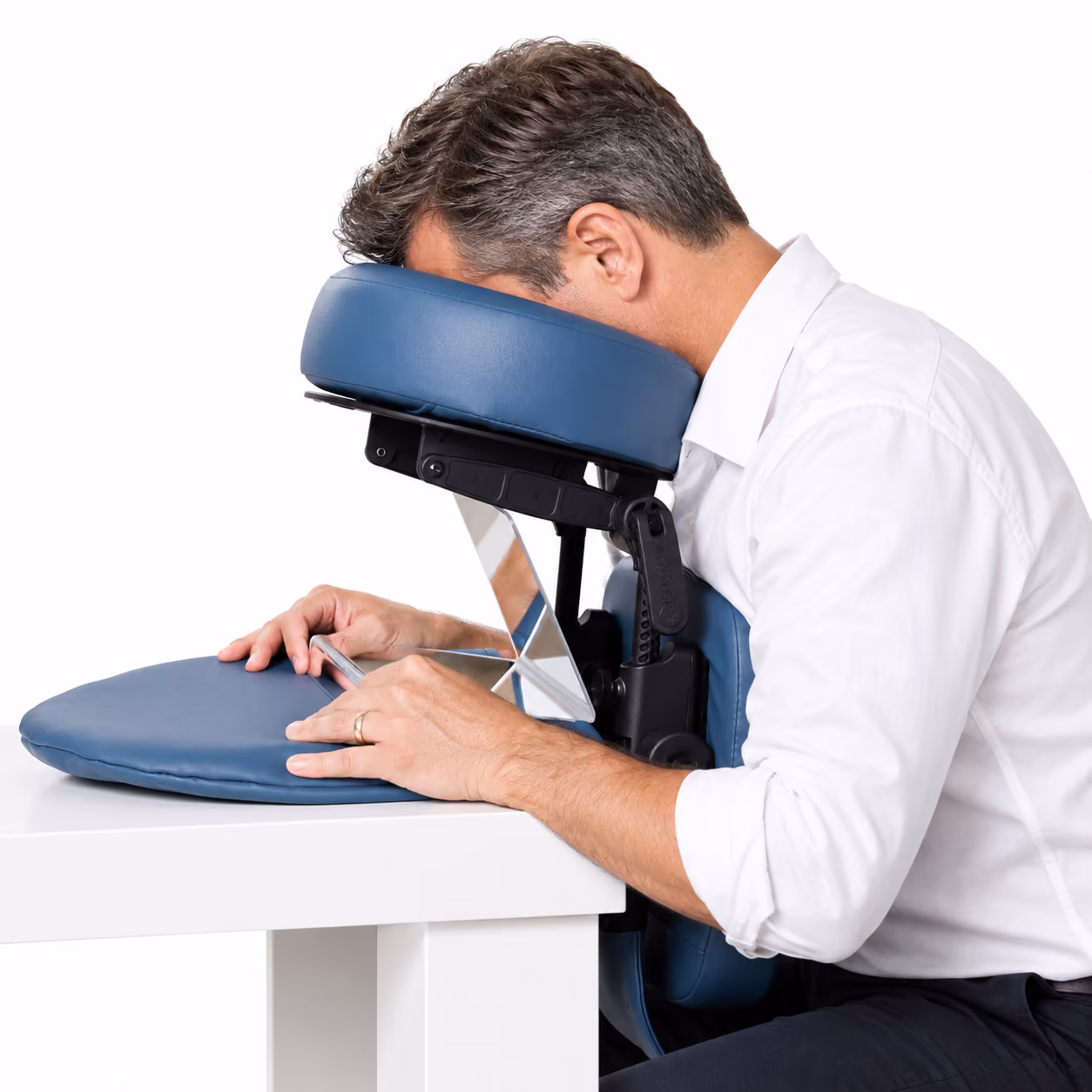 A middle age man face down on a portable face down device