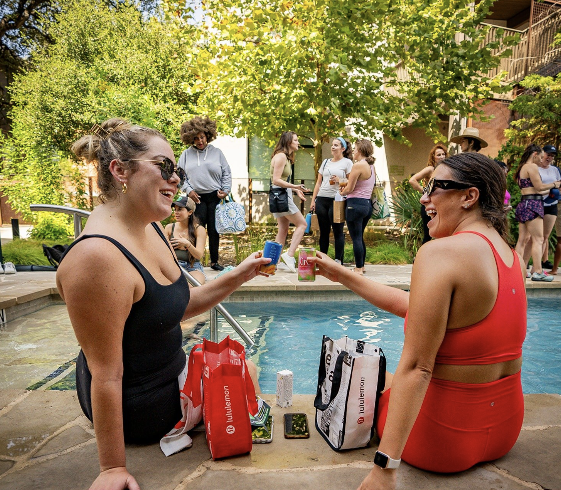 Team connecting poolside after a Swift Fit event