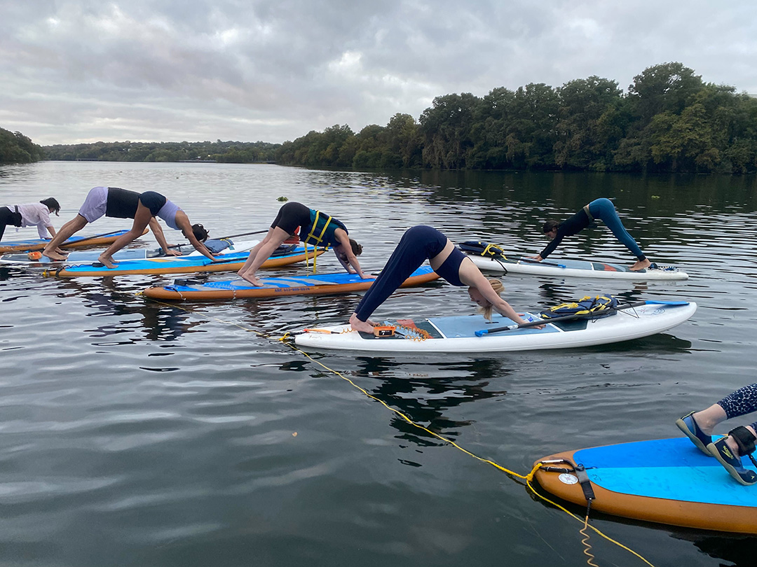 Yoga on paddleboards on Lady Bird Lake in Austin