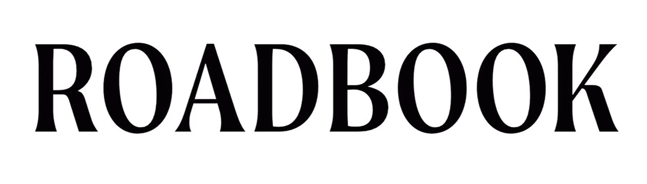 The word ROADBOOK in large uppercase serif font on a dark background.