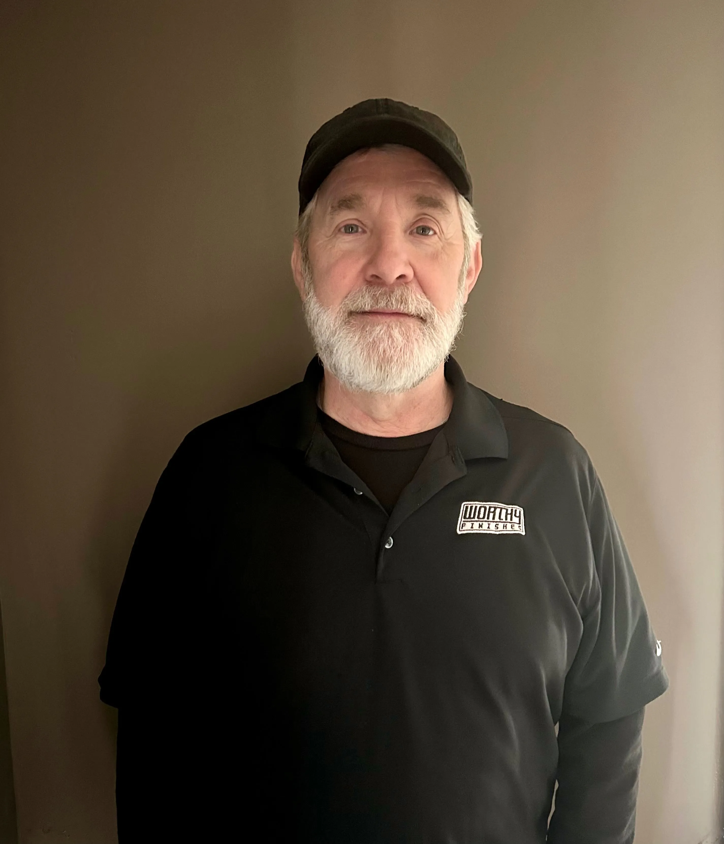 Worthy Finishes painting crew member in Greater Lansing Michigan