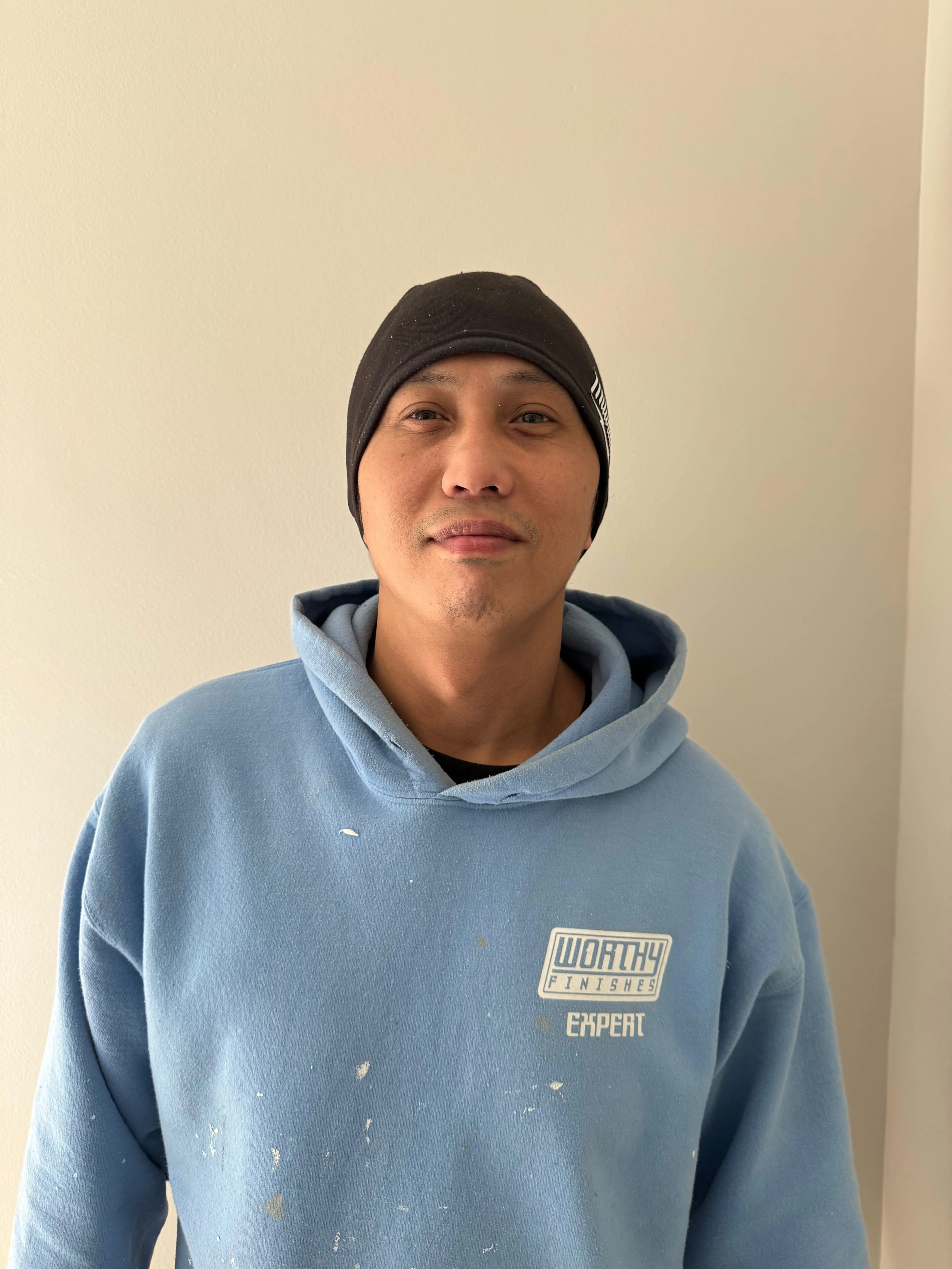 Worthy Finishes painting crew member in Greater Lansing Michigan