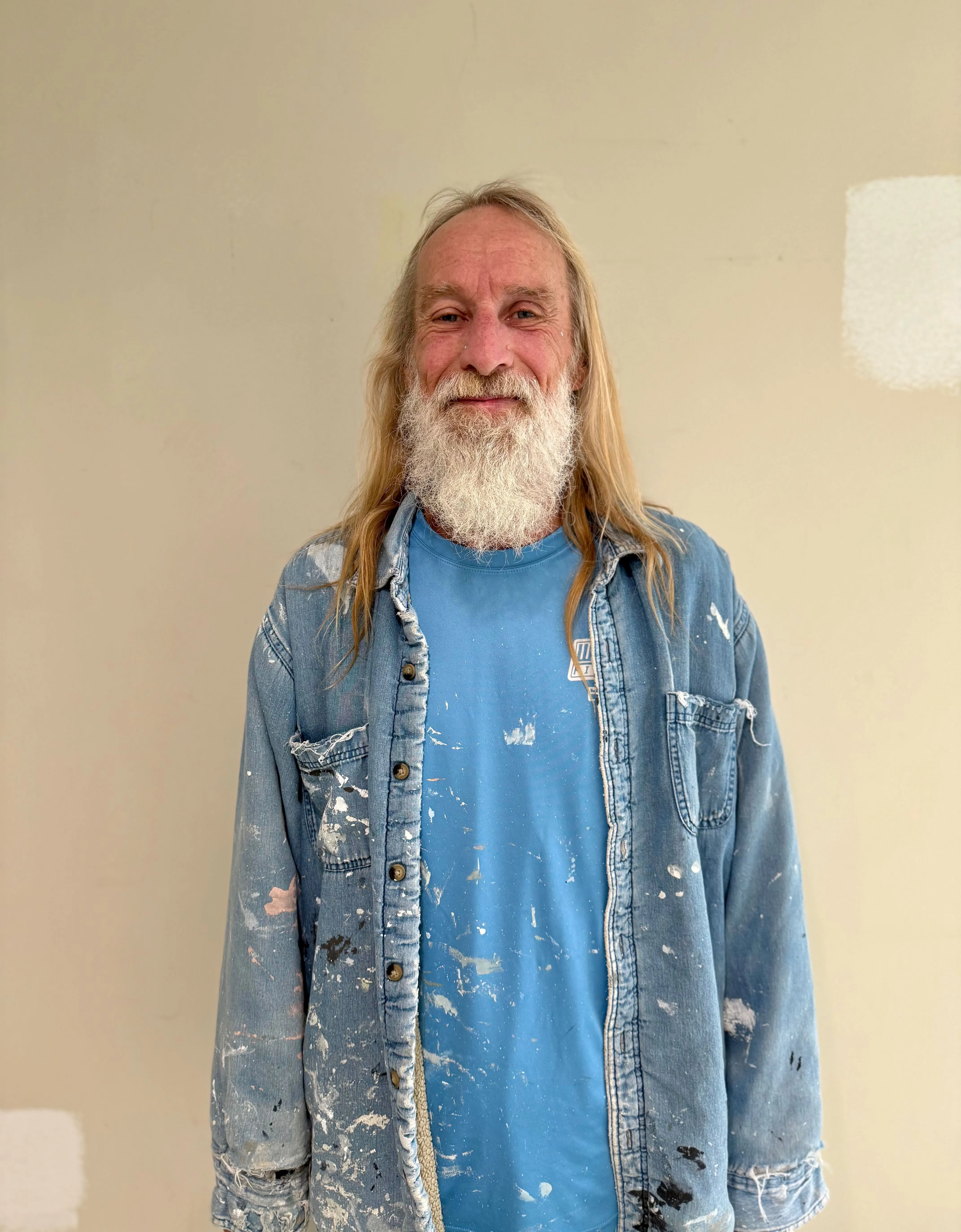 Worthy Finishes painting crew member in Greater Lansing Michigan