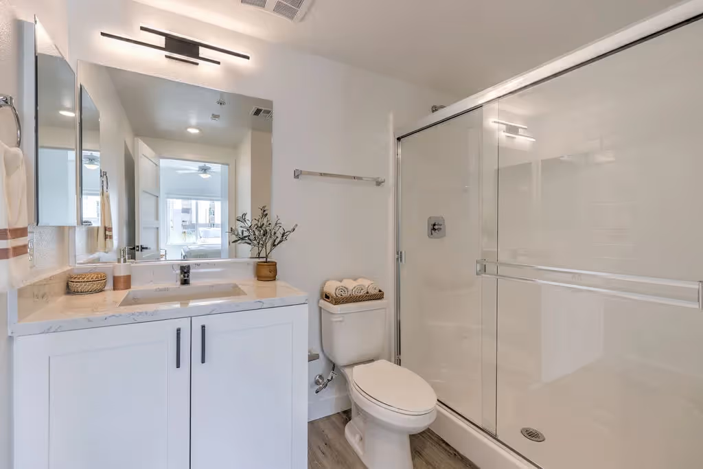 bathroom with white cabinets 