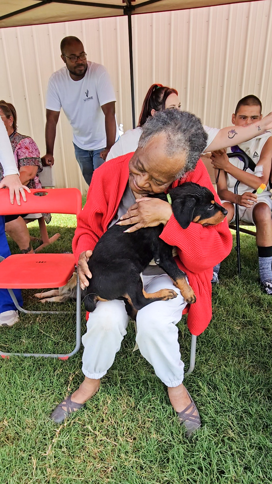Two women smiling and fist bumping 
