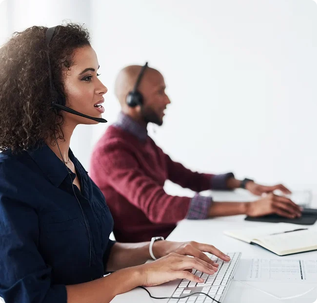Energy specialists on calls at their desks
