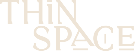Light beige stylized text reading 'THIN SPACE' on a transparent background.