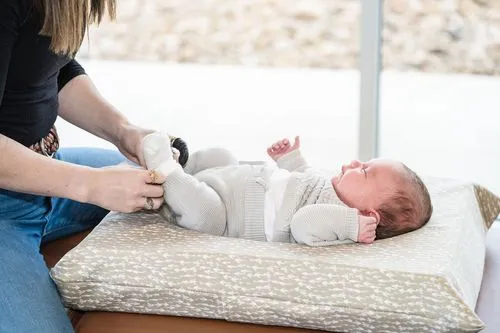 Baby receiving gentle adjustment for colic and digestive wellness
