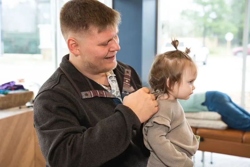 A chiropractor at Ignite Chiropractic performing a gentle, pediatric-specific adjustment on a young child to support nervous system development, immune function, and overall wellness naturally.