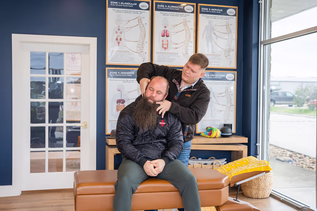 A chiropractor at Ignite Chiropractic gently adjusting a patient’s neck to support pain relief, nervous system function, and overall mobility naturally.