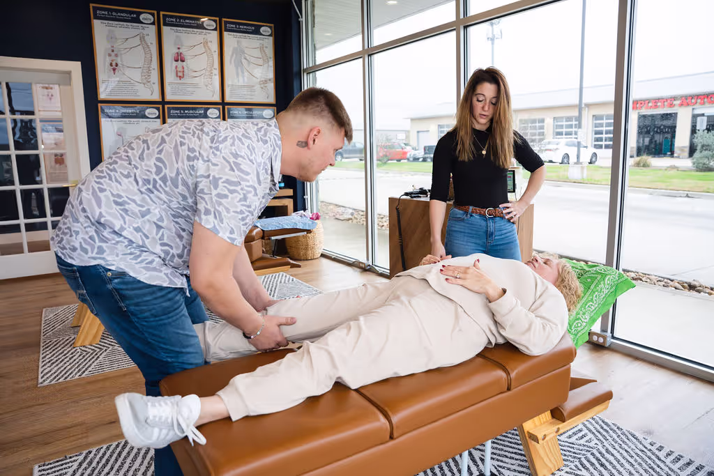 A chiropractor at Ignite Chiropractic gently adjusting a patient to support knee pain relief, improve mobility, and enhance overall nervous system function naturally.