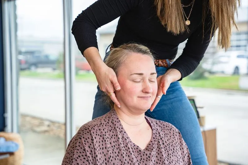 A chiropractor at Ignite Chiropractic performing a precise adjustment on an adult patient to support nervous system function, relieve back pain, and improve overall wellness naturally.