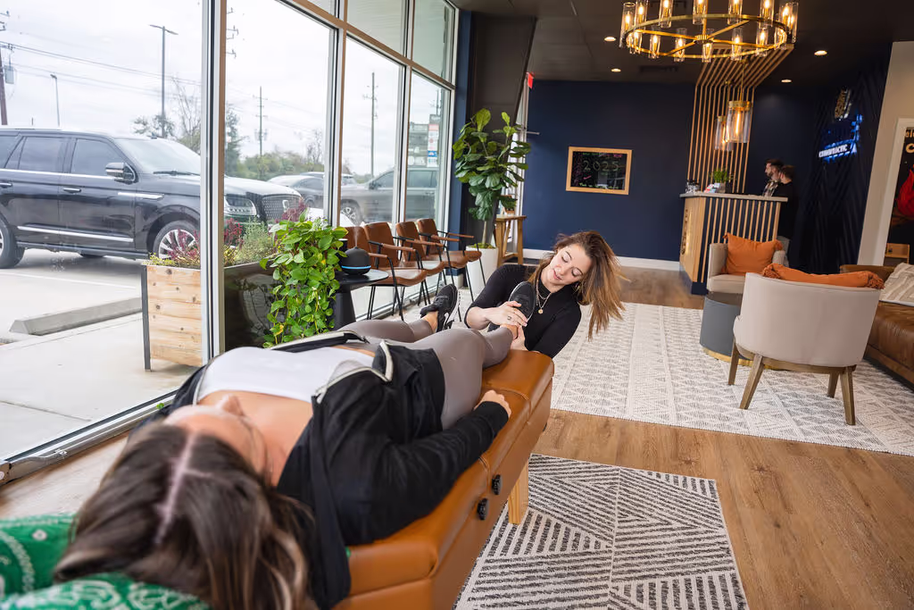 A chiropractor at Ignite Chiropractic gently adjusting a patient’s foot to support neuropathy relief, nervous system function, and overall well-being naturally.