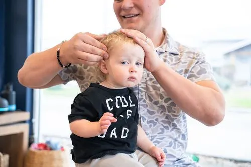 A chiropractor at Ignite Chiropractic, performs a gentle adjustment on a patient seeking natural support for stress management and emotional balance through improved nervous system function.