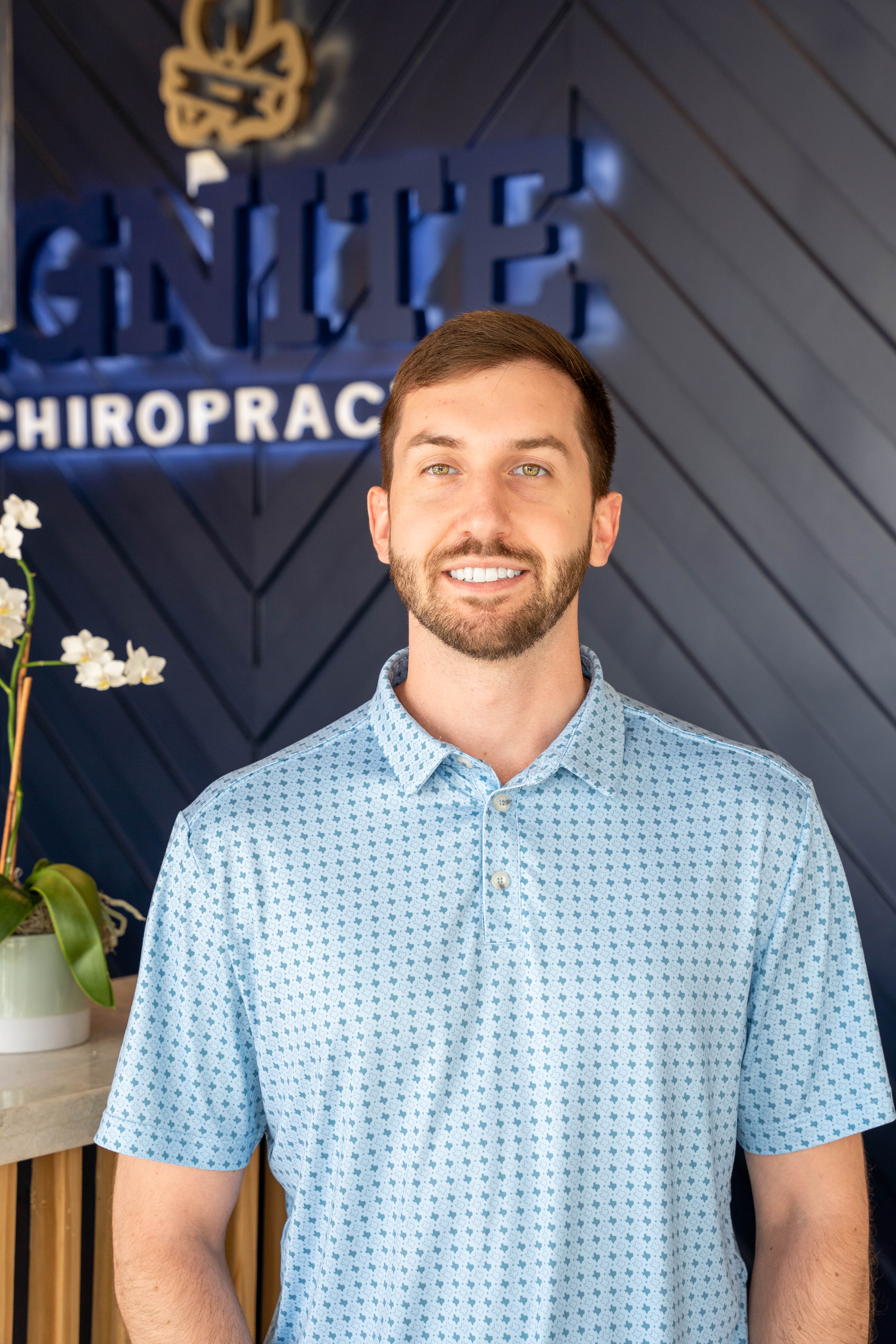 An employee of Ignite Chiropractic in Cypress, TX smiling.