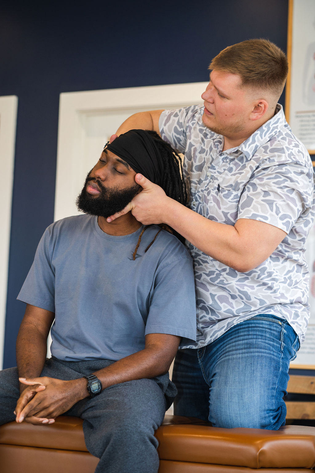 A chiropractor adjusting a patient's cervical spine near Argyle, TX.