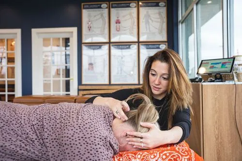 A chiropractor at Ignite Chiropractic performing a gentle spinal adjustment to support respiratory function, promoting natural lung expansion, nervous system balance, and improved breathing.
