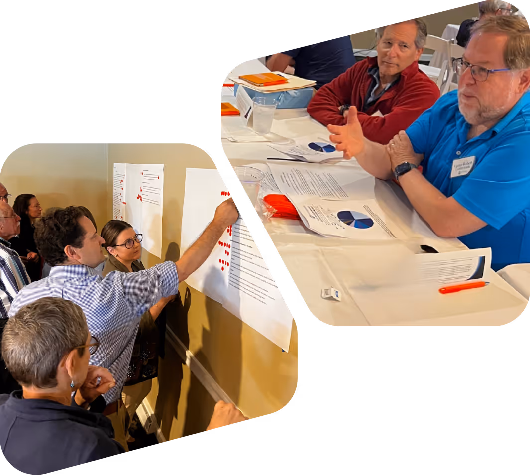 Group of people collaborating and placing red stickers on large papers on a wall, and two men discussing charts and documents at a table.