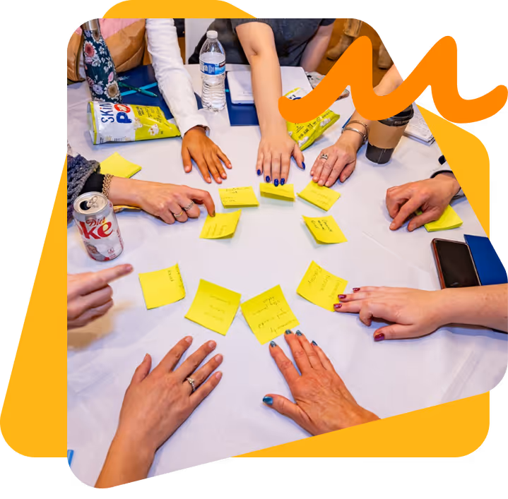 Professional leading a supportive team session, representing a culture of care and well-being in the workplace.