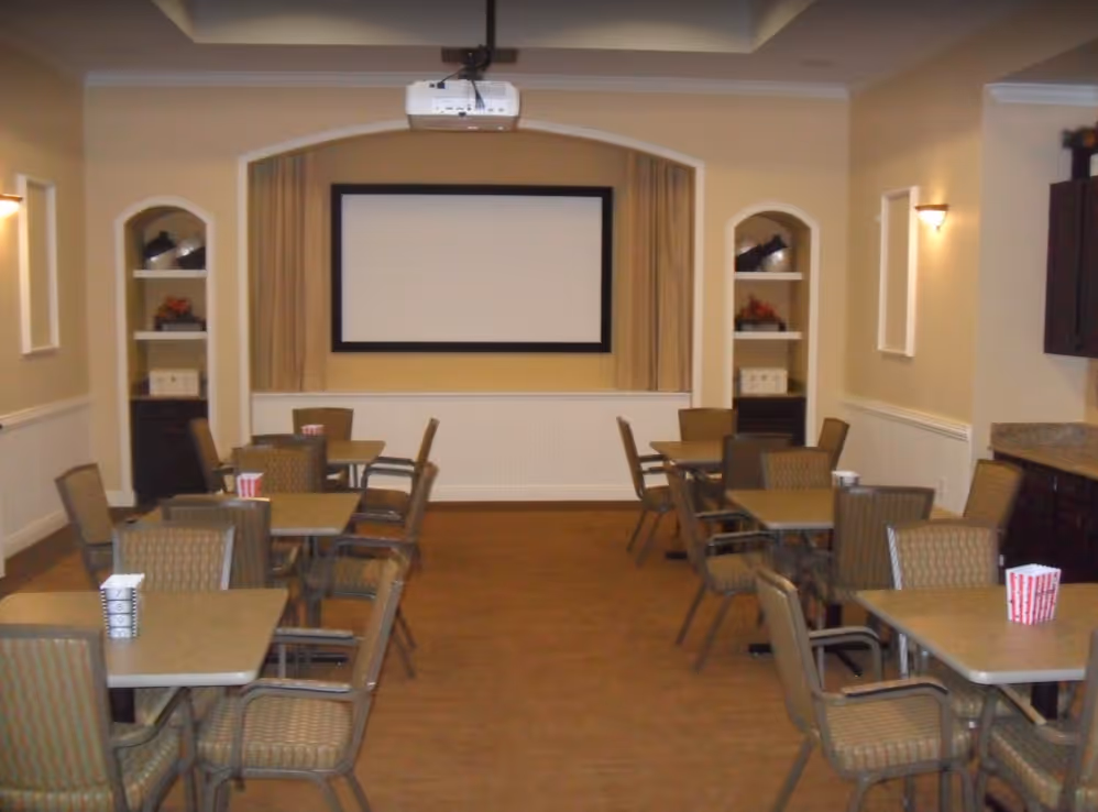 community theatre room with chairs and projector screen