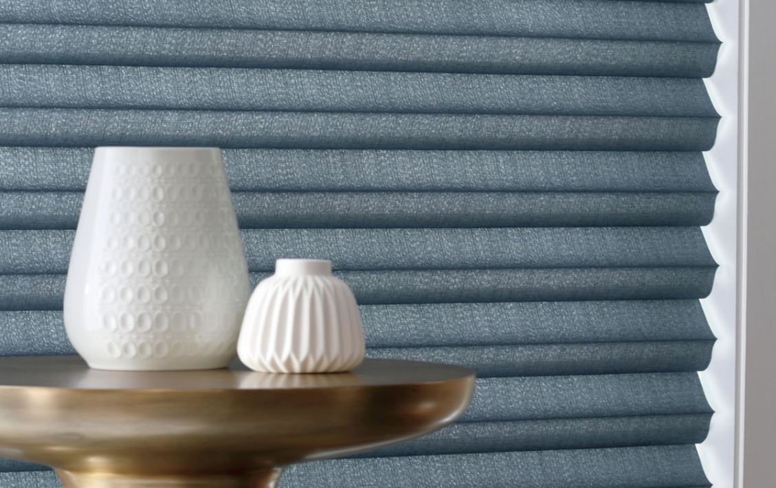 Close-up of blue textured pleated shades from top window covering stores in Reno, NV