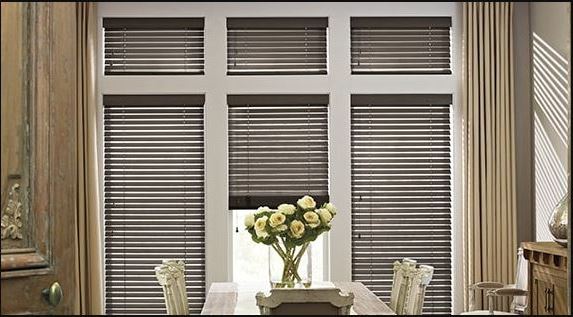 Elegant dining room featuring dark wood Truckee, CA window blinds for style and privacy.