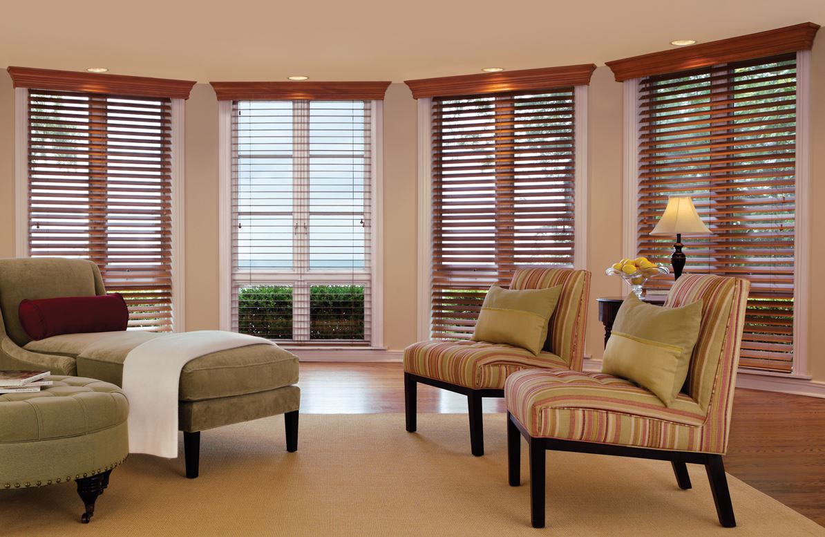 Multiple wood horizontal Reno, NV window blinds installed flawlessly in a bright sitting room