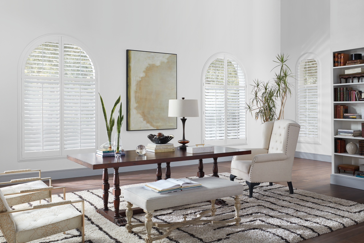 Custom plantation shutters fitted to a corner window, controlling light and privacy